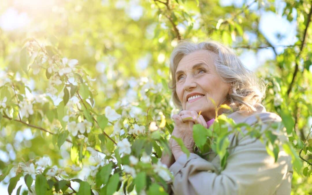 Smiling Senior Woman Surrounded by Nature_The Grove on Forest Lane