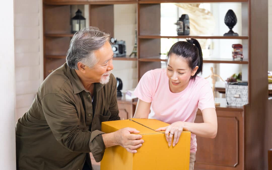 Senior Asian Man and Daughter Packing Box_The Grove on Forest Lane