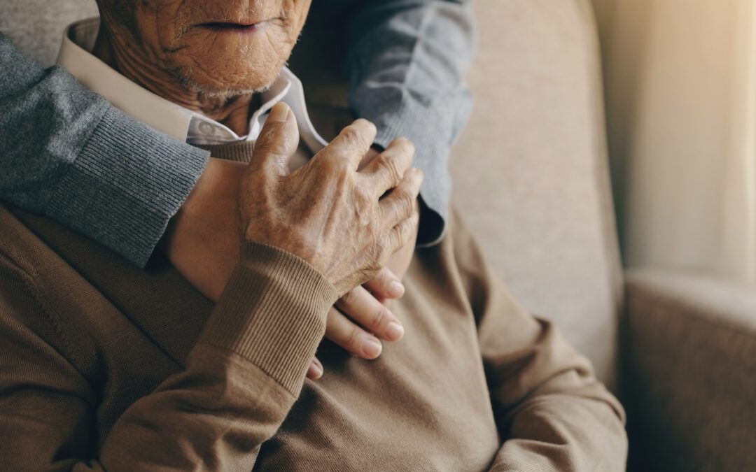 Caregiver holding Senior Man's Hand from Behind_The Grove on Forest Lane