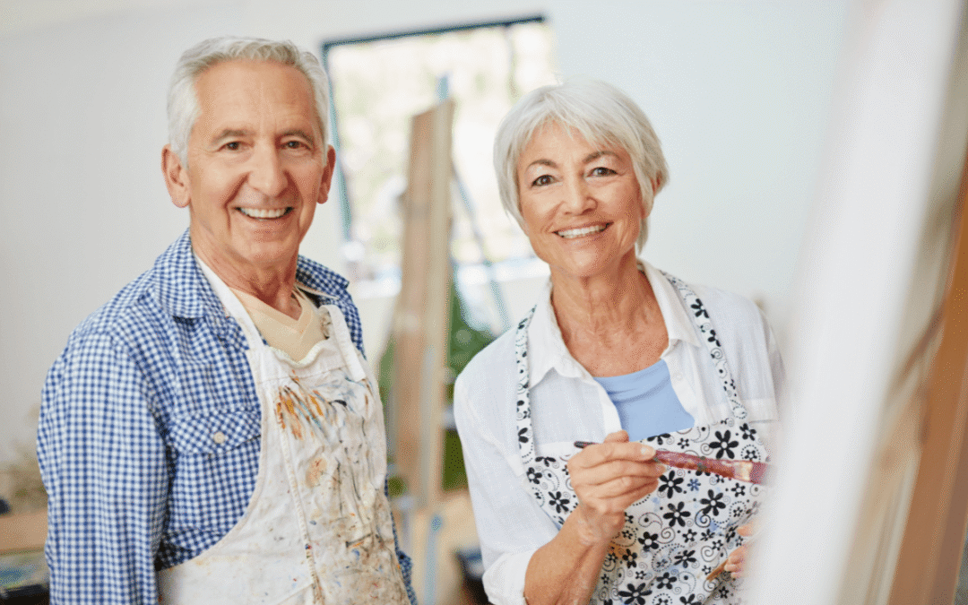 Shot of a senior couple painting at home.